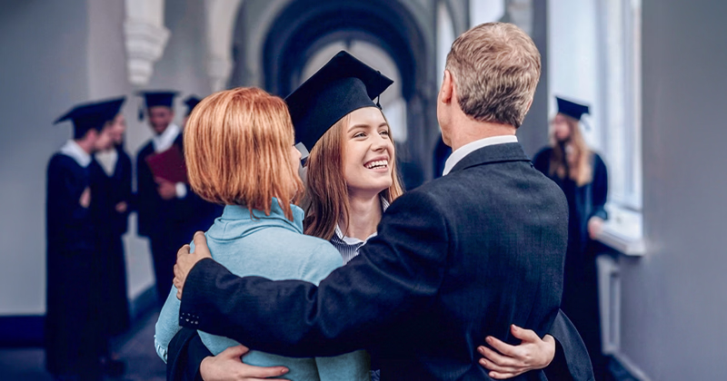 A career college graduate celebrating with her parents after completing a diploma program.